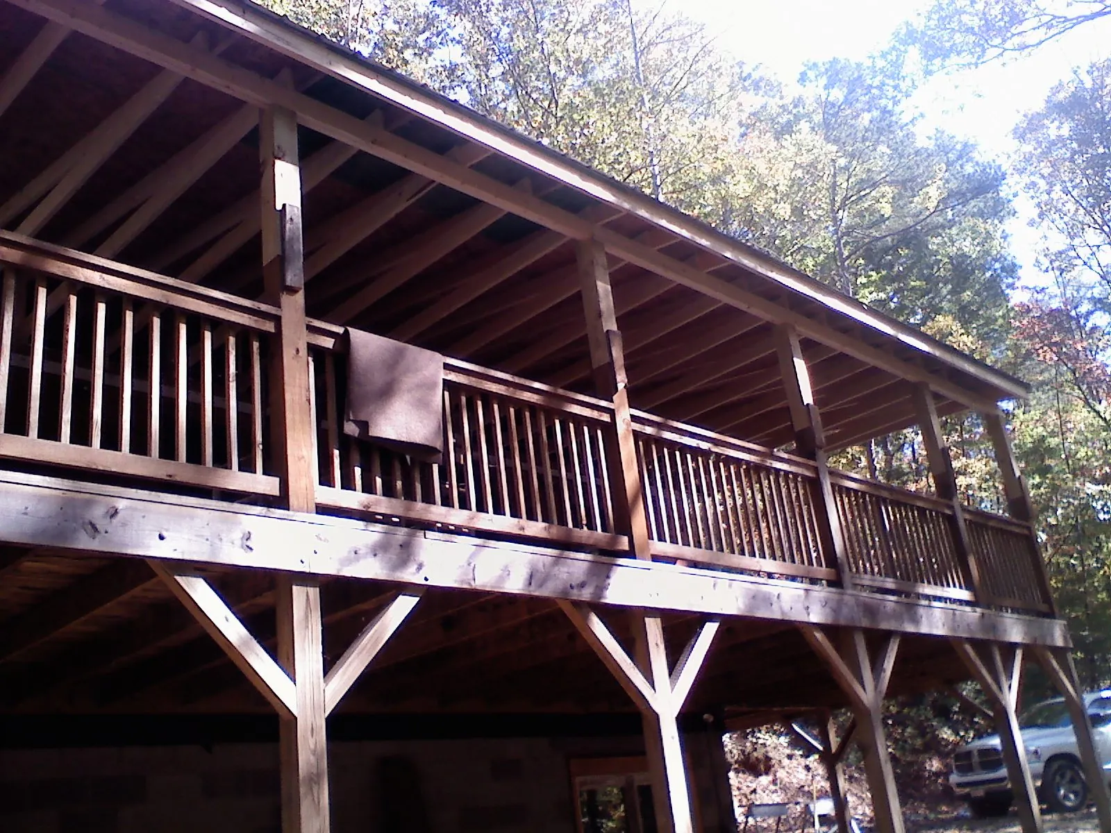 Timber framing under a new elevated porch and deck — Roof Leak Repair in Great Lakes by Roofing Brothers